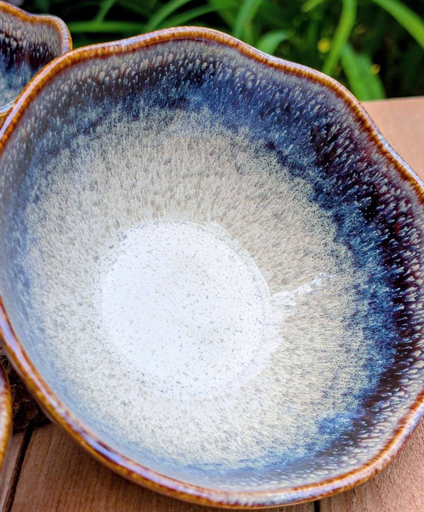 Bring understated elegance to everyday dining with this set of three RIRAKU stackable stoneware bowls. Featuring organically scalloped rims and beautifully layered reactive glazes inspired by traditional Japanese pottery, these versatile bowls are perfect for soups, rice, snacks, desserts, and small shared dishes.