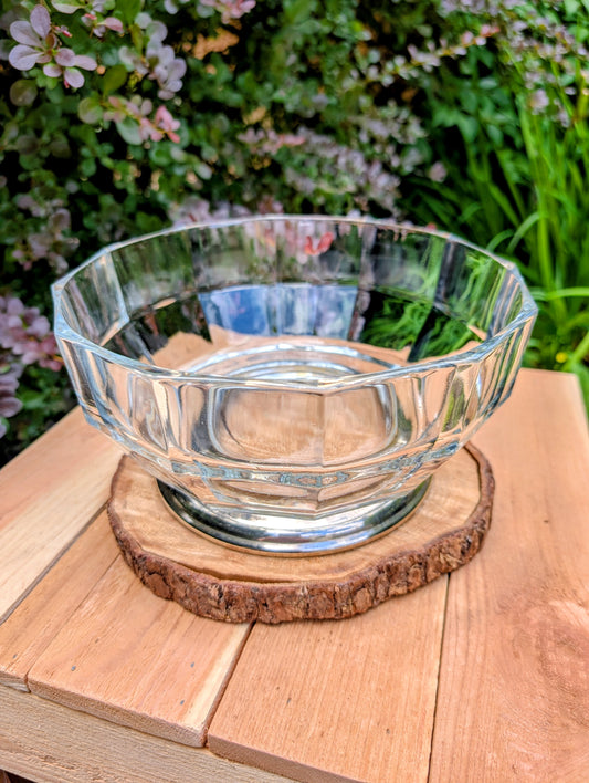 Bring timeless elegance to your table with this vintage crystal decagon pedestal bowl featuring a beautifully faceted design and silver-plated base. Perfect as a centerpiece, serving bowl, or decorative accent, it blends classic sophistication with versatile year-round style.