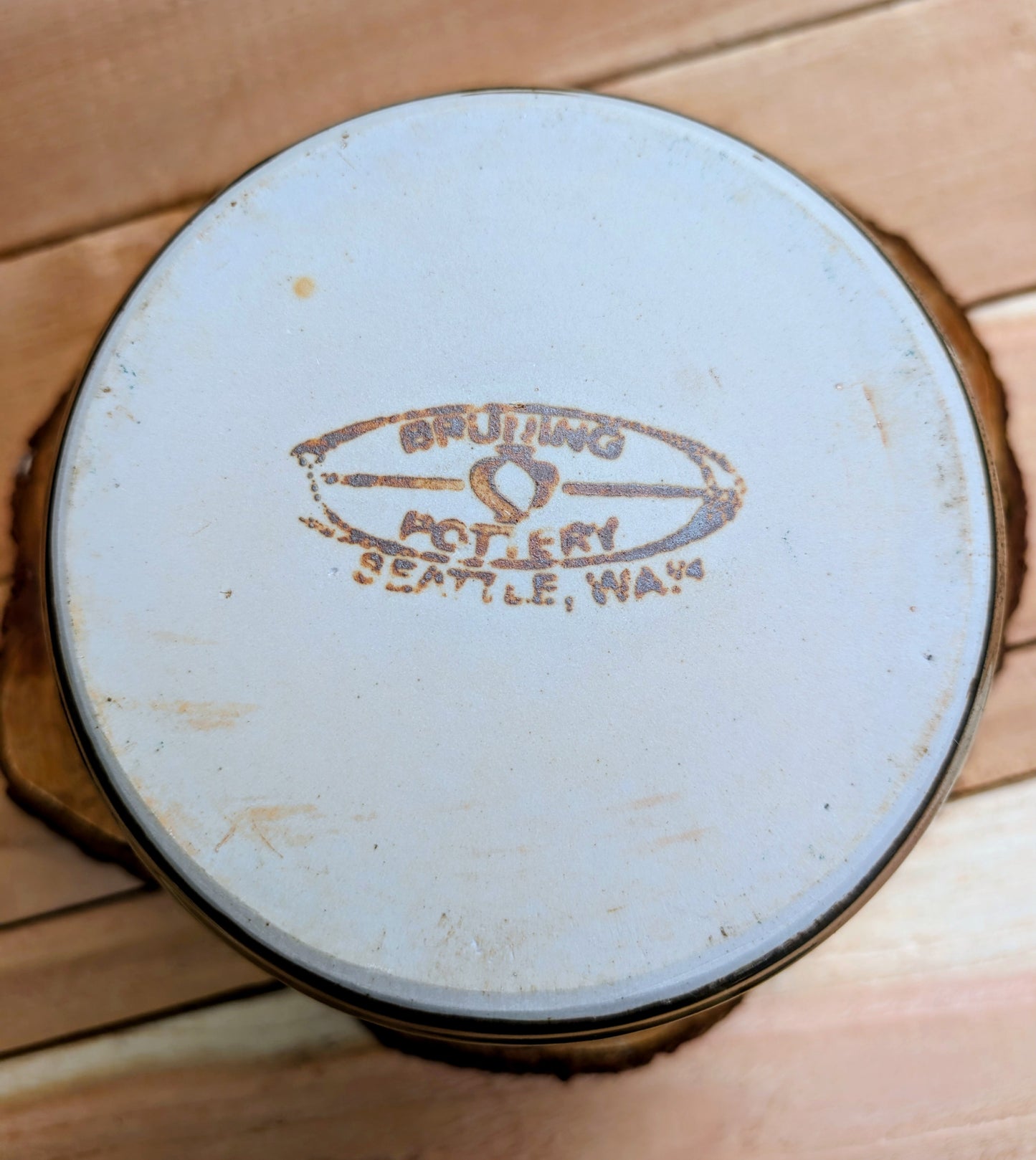Bring the warmth of Pacific Northwest craftsmanship to your home with this authentic Bruning Pottery stoneware bowl from the studio's Seattle era. Featuring a rich iron-speckled glaze and wheel-thrown construction, it's equally beautiful as a serving bowl, planter cachepot, or decorative display piece.