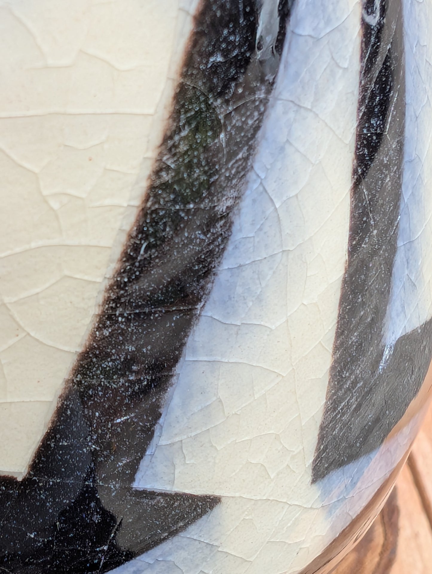 A striking signed studio pottery vase created by Sarah Palman in 1995, featuring bold black abstract arrow motifs over an ivory crackle glaze. This handcrafted ceramic sculpture blends modern design with timeless craftsmanship, making it equally beautiful displayed alone or with dried botanicals.