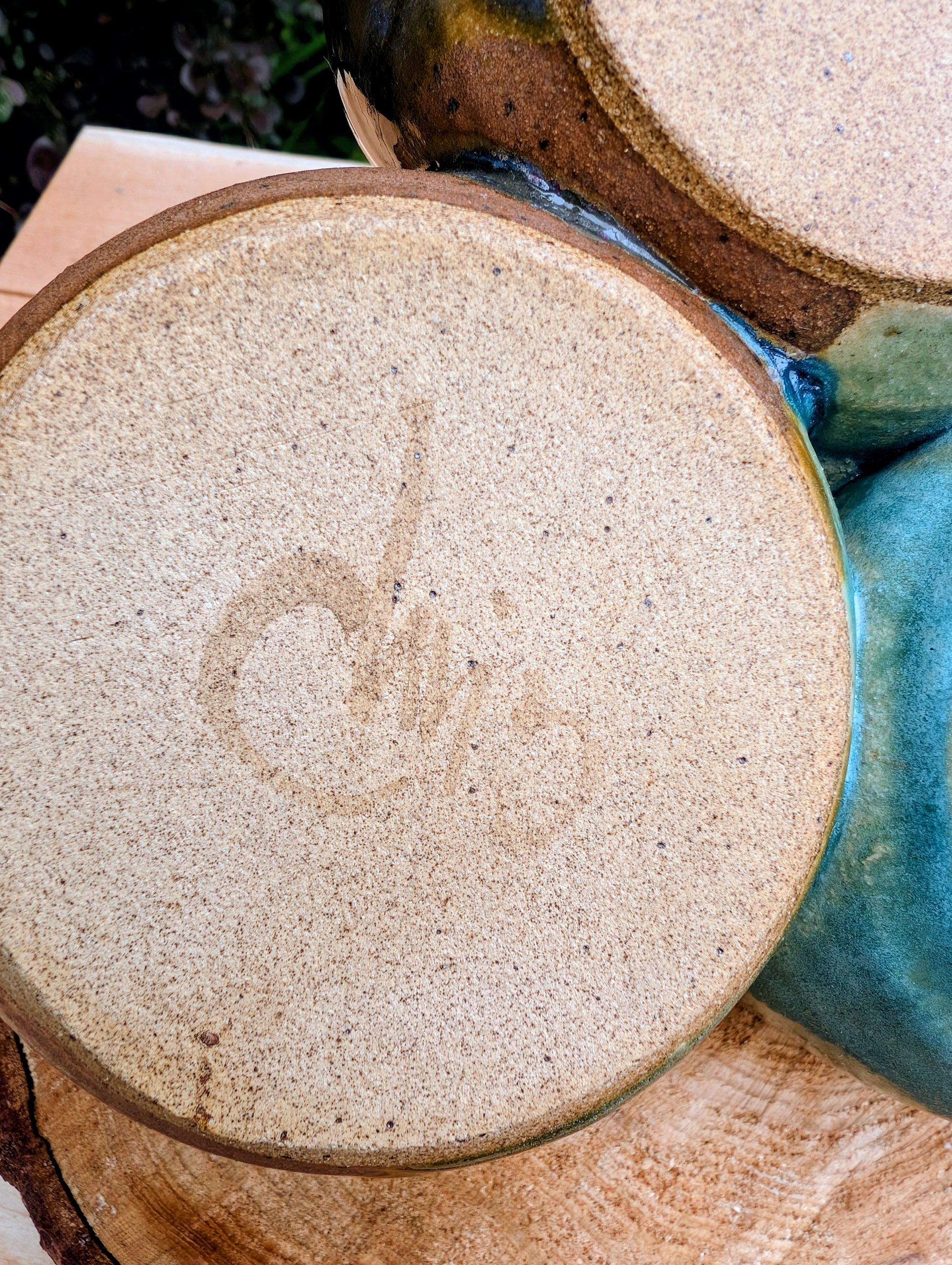 Beautifully handcrafted and artist signed, this three-bowl stoneware condiment server combines sculptural artistry with everyday functionality. Finished in layered seafoam, aqua, moss, and earthy glazes, it brings timeless craftsmanship and Pacific Northwest-inspired beauty to entertaining.