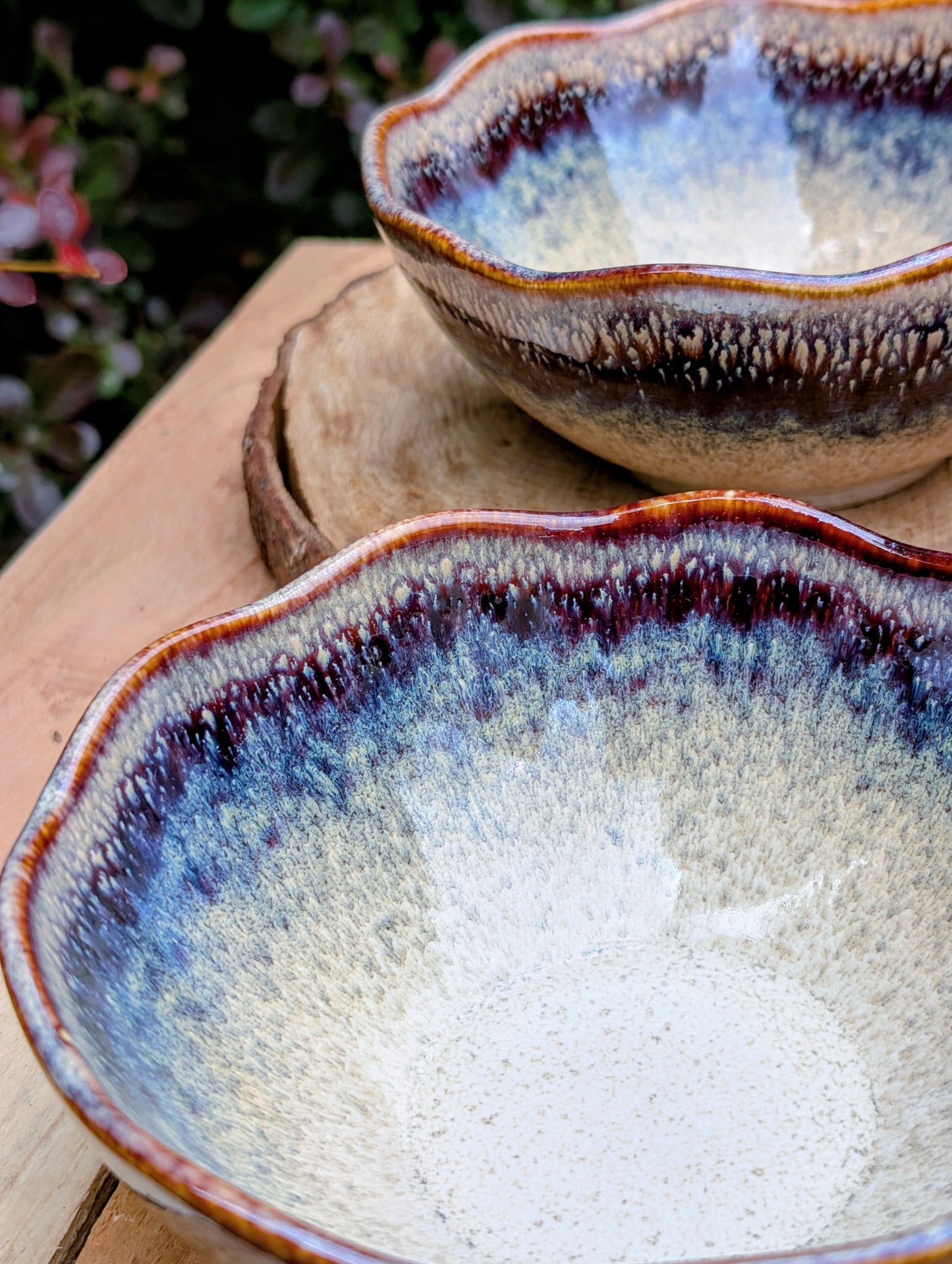 Bring understated elegance to everyday dining with this set of three RIRAKU stackable stoneware bowls. Featuring organically scalloped rims and beautifully layered reactive glazes inspired by traditional Japanese pottery, these versatile bowls are perfect for soups, rice, snacks, desserts, and small shared dishes.