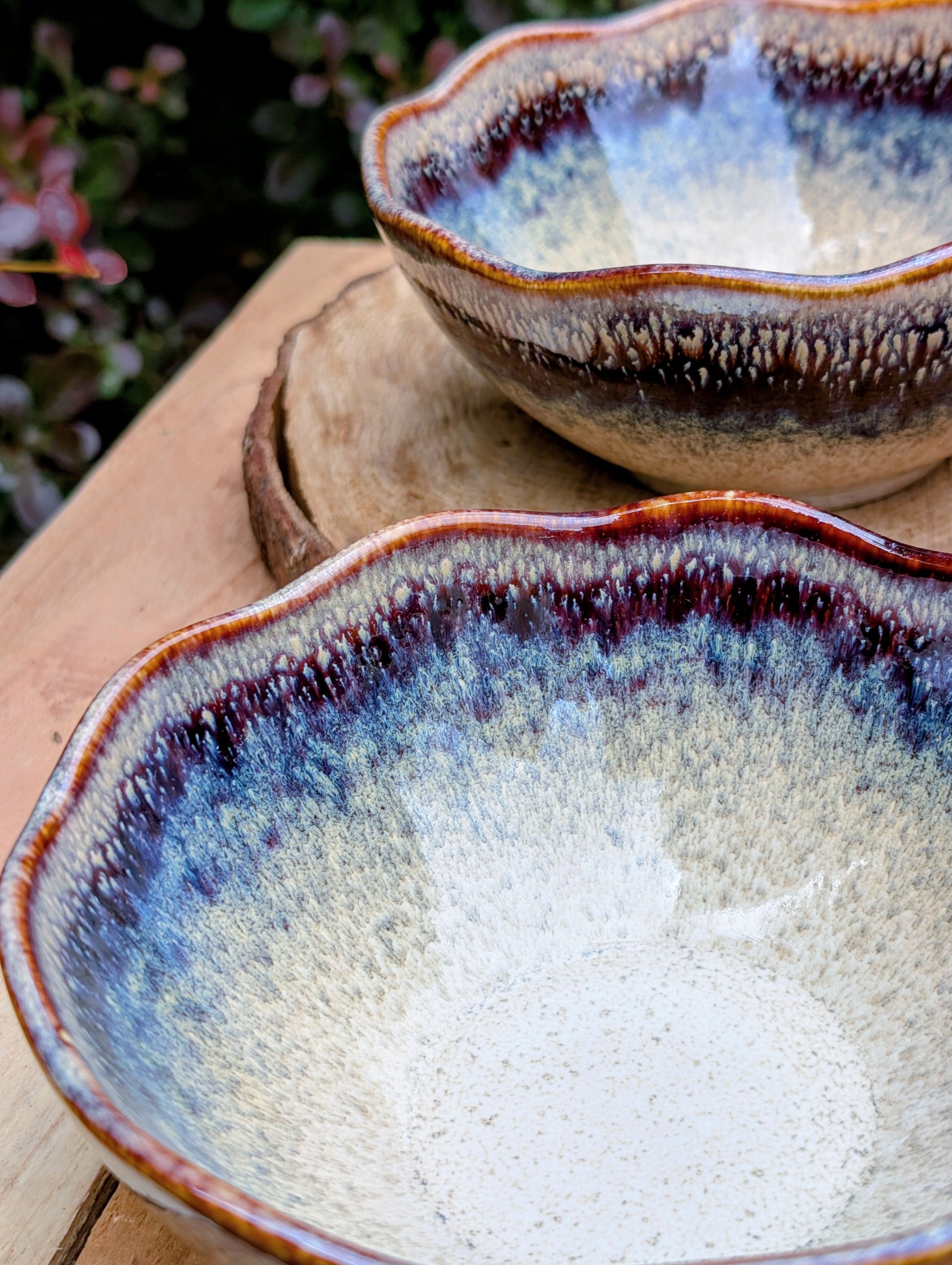 Bring understated elegance to everyday dining with this set of three RIRAKU stackable stoneware bowls. Featuring organically scalloped rims and beautifully layered reactive glazes inspired by traditional Japanese pottery, these versatile bowls are perfect for soups, rice, snacks, desserts, and small shared dishes.