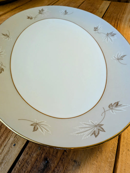 Bring timeless elegance to your garden with this repurposed vintage Zylstra Select Fine China serving platter. Featuring the delicate Frosted Leaves pattern with gold trim, this one-of-a-kind bird feeding platter blends mid-century craftsmanship with sustainable outdoor living.