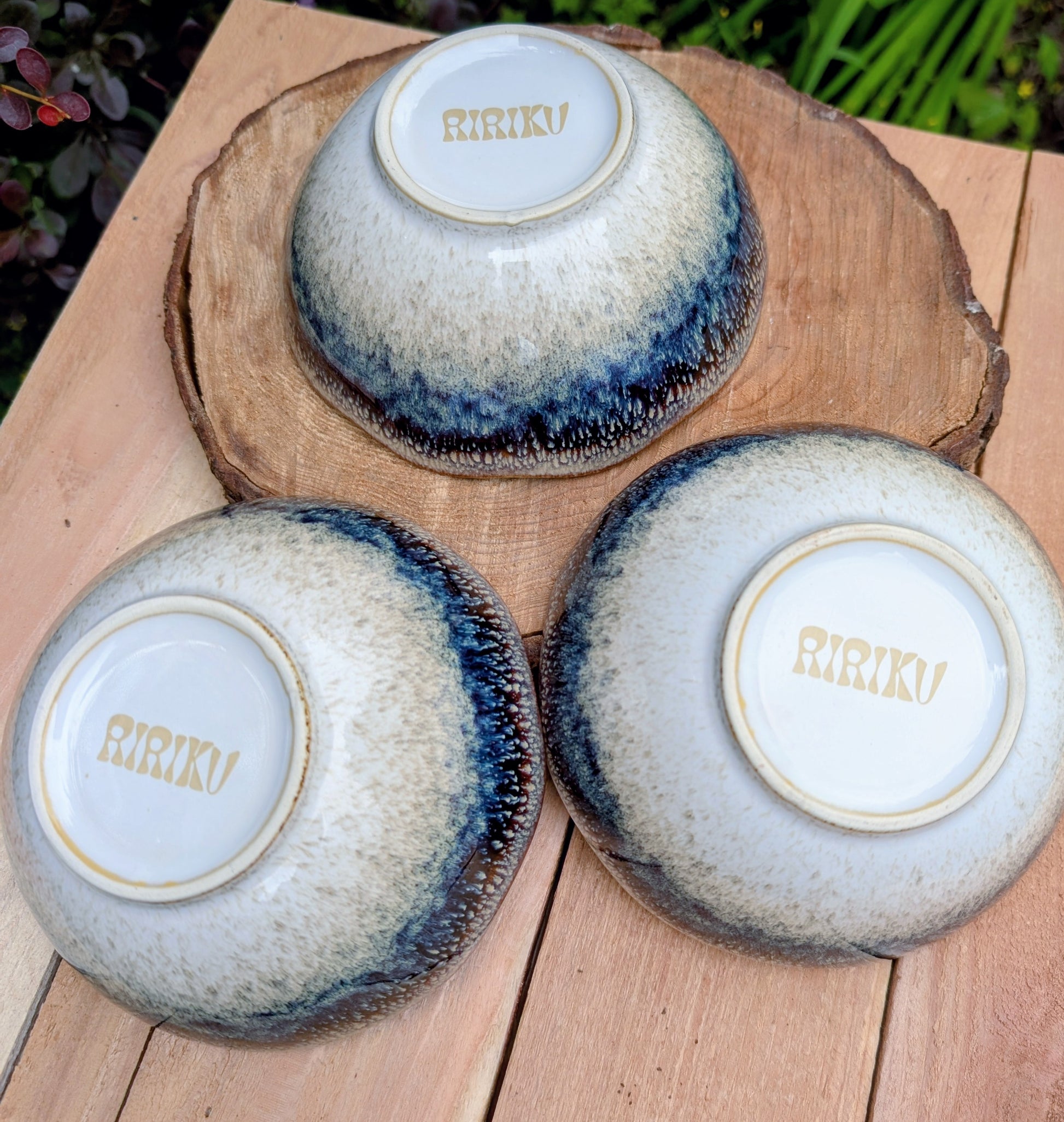 Bring understated elegance to everyday dining with this set of three RIRAKU stackable stoneware bowls. Featuring organically scalloped rims and beautifully layered reactive glazes inspired by traditional Japanese pottery, these versatile bowls are perfect for soups, rice, snacks, desserts, and small shared dishes.