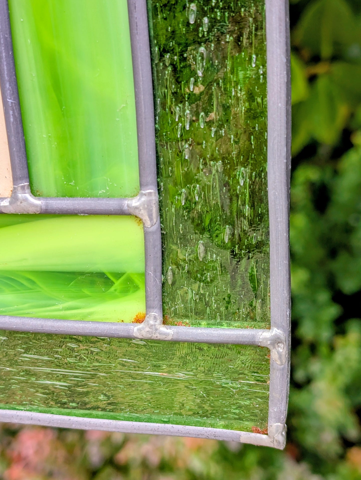 Bring the beauty of a hummingbird in bloom into your home with this handcrafted stained glass hanging panel. Featuring vibrant textured art glass surrounding a detailed hummingbird and hibiscus centerpiece, it catches natural light beautifully and adds year-round color to any window, sunroom, or garden-inspired space.