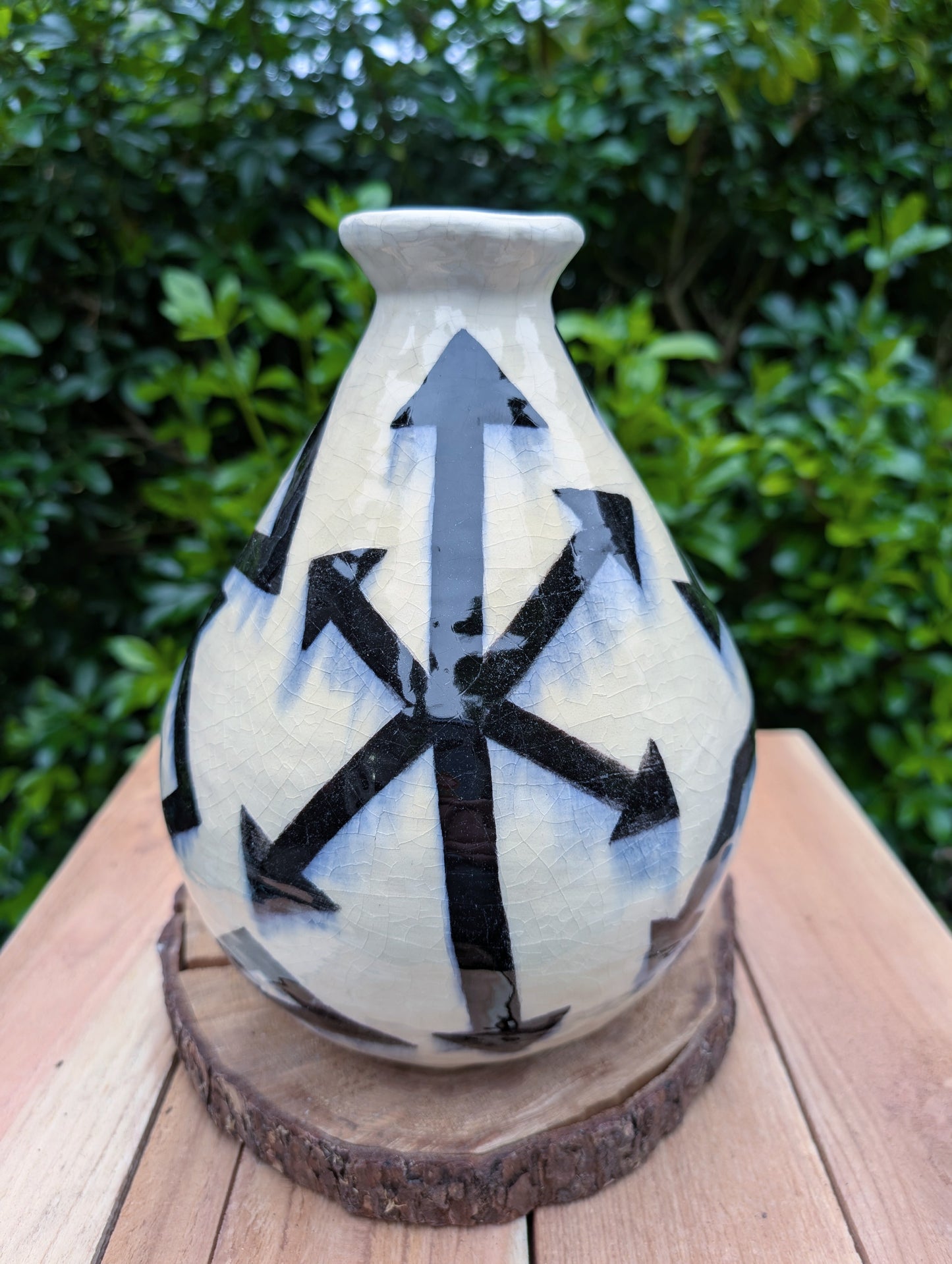 A striking signed studio pottery vase created by Sarah Palman in 1995, featuring bold black abstract arrow motifs over an ivory crackle glaze. This handcrafted ceramic sculpture blends modern design with timeless craftsmanship, making it equally beautiful displayed alone or with dried botanicals.