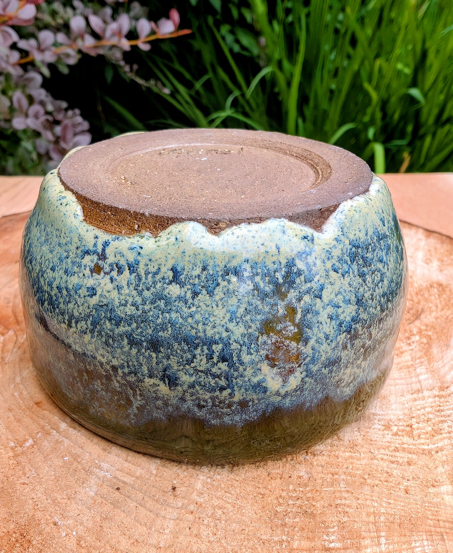A beautifully hand-thrown studio pottery bowl featuring a rich olive green interior and layered blue, cream, and earthy brown glaze. Signed by the artist, this compact stoneware piece blends functional craftsmanship with timeless Pacific Northwest style.