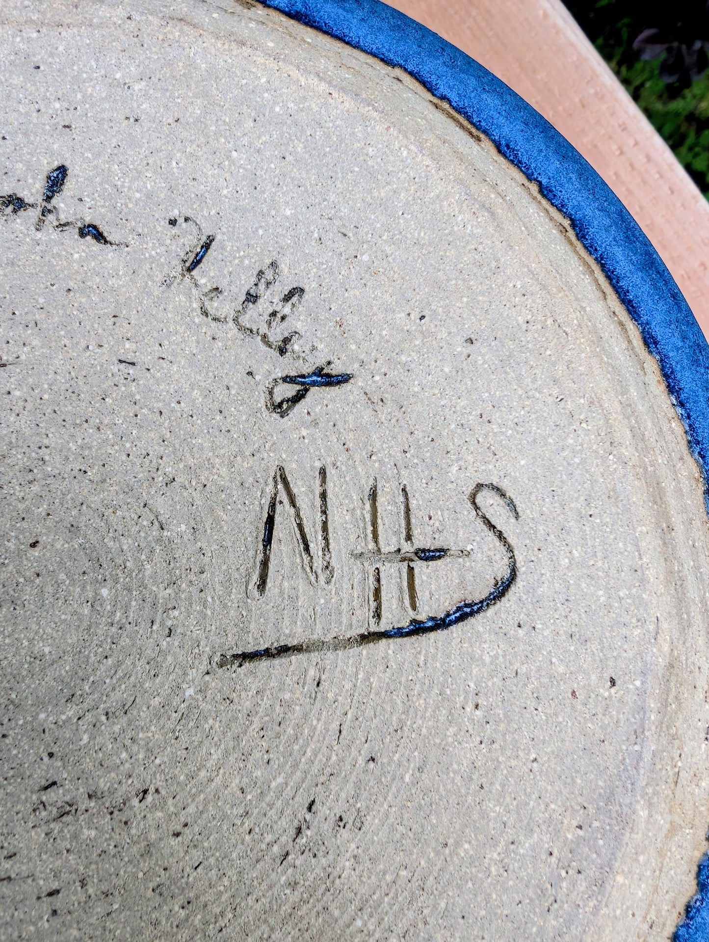 A beautifully hand-thrown studio pottery bowl dated 1990, featuring a rich satin cobalt blue glaze with a subtle spiral movement across the interior. Signed by the artist (maker currently unconfirmed), this functional stoneware piece blends everyday usefulness with timeless handcrafted artistry.