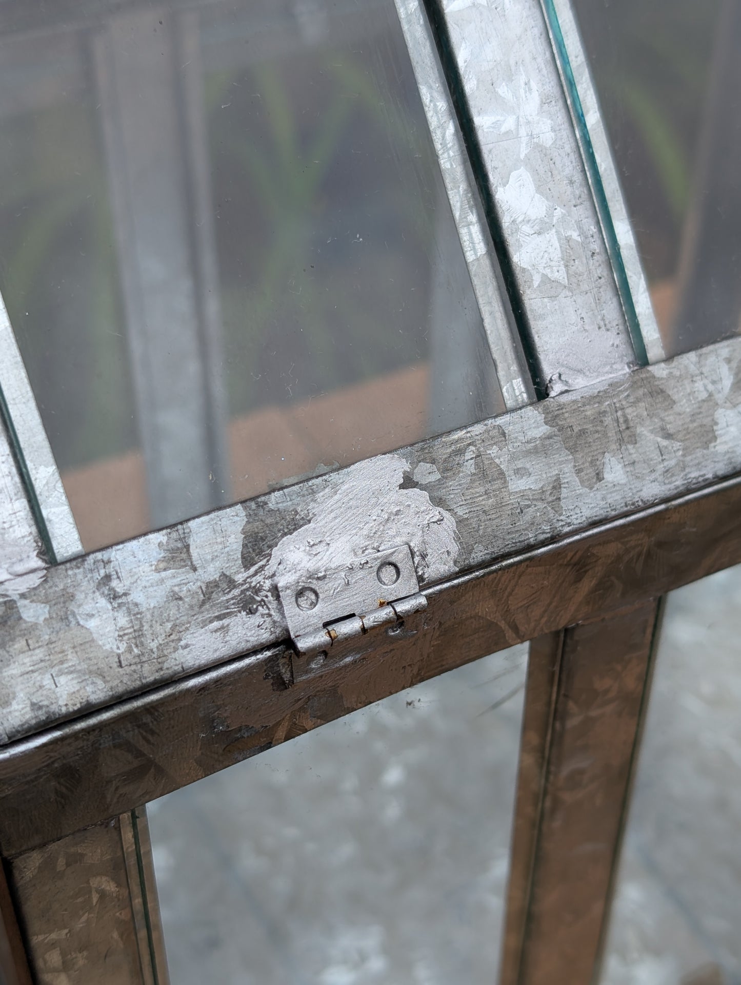 Bring the charm of a Victorian conservatory indoors with this decorative galvanized metal and glass tabletop greenhouse. Perfect for displaying succulents, moss gardens, candles, seasonal décor, or treasured collectibles, it adds timeless botanical style to any room.