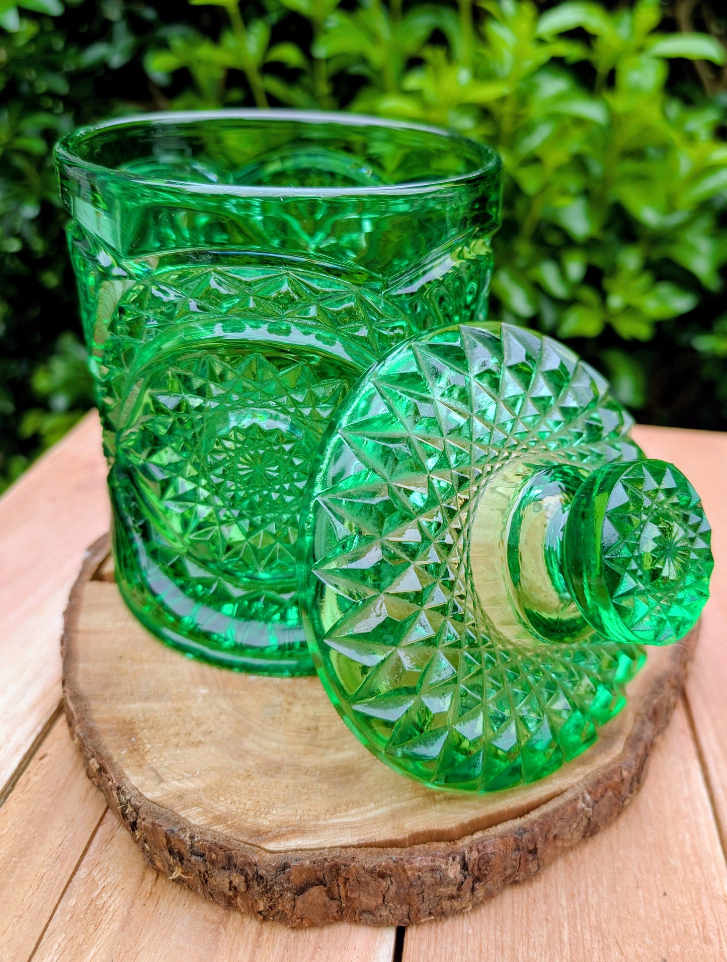 A brilliant Mid-Century collectible crafted in rich emerald pressed glass featuring Imperial's iconic Hobstar pattern.