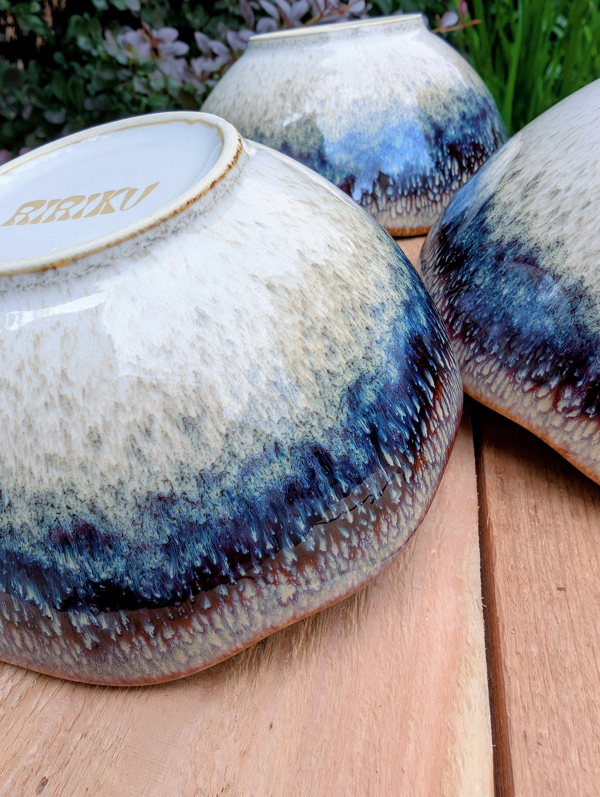 Bring understated elegance to everyday dining with this set of three RIRAKU stackable stoneware bowls. Featuring organically scalloped rims and beautifully layered reactive glazes inspired by traditional Japanese pottery, these versatile bowls are perfect for soups, rice, snacks, desserts, and small shared dishes.