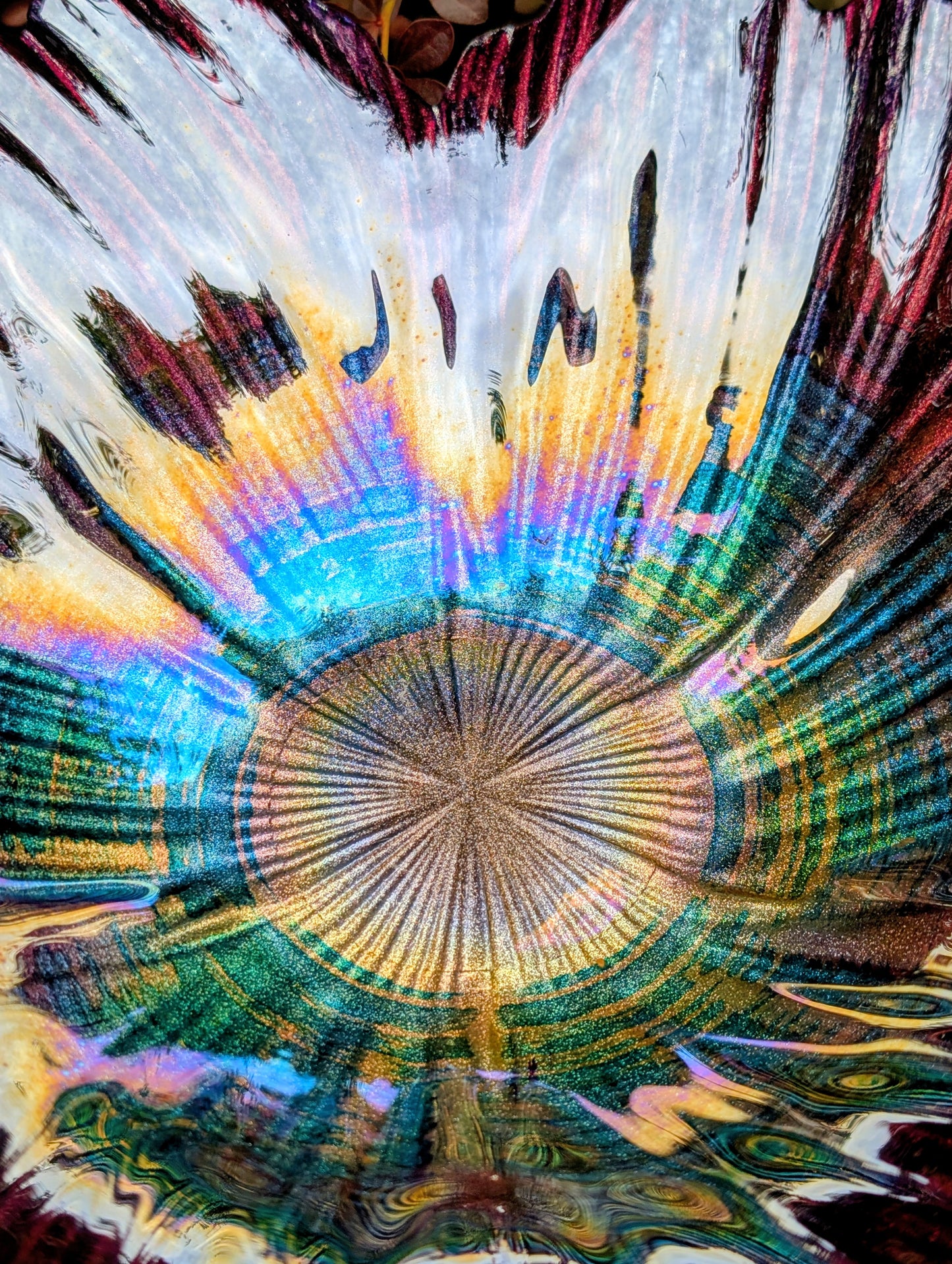 Bring color and artistry to your home or garden with this iridescent art glass floral bowl. Featuring shimmering purple and blue hues, it serves beautifully as either a striking tabletop centerpiece or a decorative bird bath bowl.