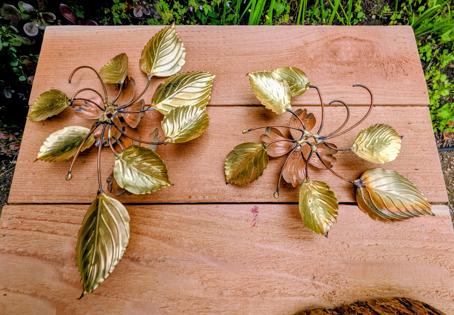 Bring the warmth of 1970s botanical décor into your home with this charming pair of vintage brass and copper-tone dogwood wall sculptures. Their delicate floral design and mixed-metal finish make them an easy addition to Mid-Century Modern, cottage, and nature-inspired interiors.